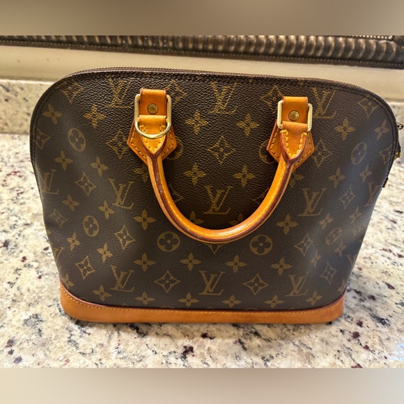 Authentic LOUIS VUITTON Alma Handbag - Picture 4 of 17